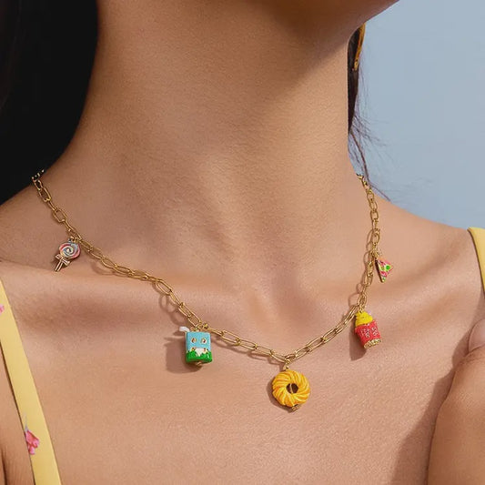 Necklace with colorful charms worn by a person against a blue sky background