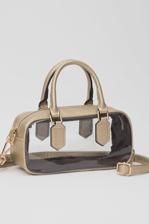 Beige handbag with clear front panel on a light gray background