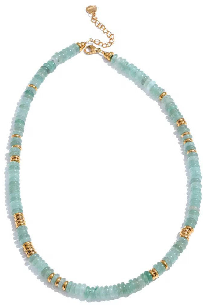 Necklace with light blue beads and gold accents on a white background