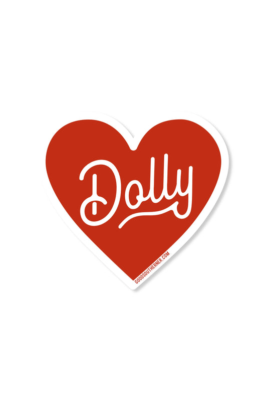 A heart-shaped red sticker with the word 'Dolly' in white script and a white border, shown on a plain white background.