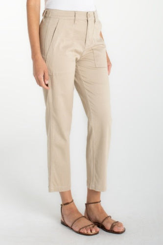 Person wearing beige pants on a white background