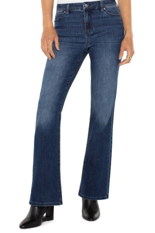 Blue jeans worn by a person on a white background