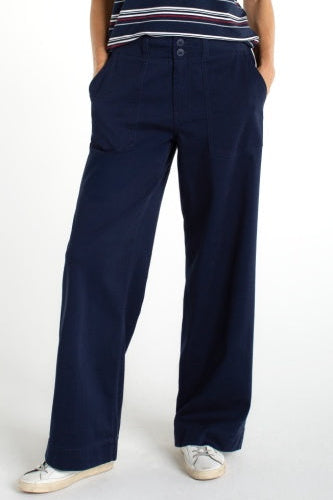 Navy blue wide-leg pants worn by a person on a white background