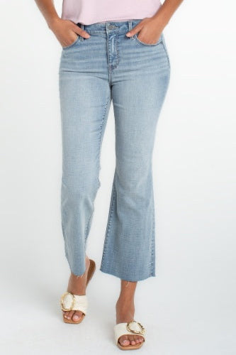 Light blue jeans worn by a person on a white background
