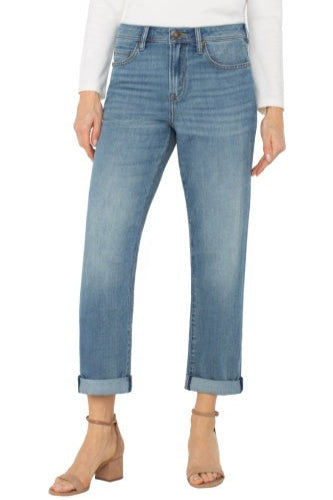 Light blue jeans worn by a person on a white background
