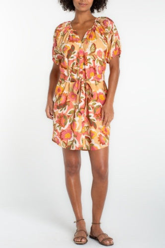 Woman wearing a floral dress on a white background