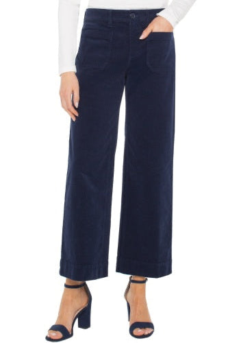 Navy wide-leg pants worn by a person on a white background