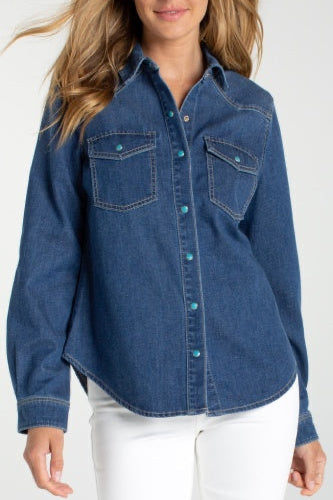 Woman wearing a blue denim shirt on a white background