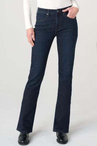 Person wearing dark blue jeans on a white background