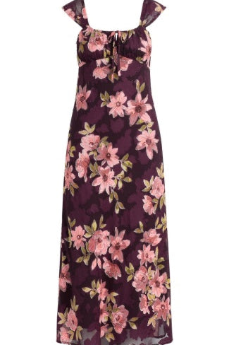 A sleeveless maxi dress with a dark purple base and a pink floral print, featuring tie-shoulder straps and a tie at the neckline, shown against a plain white background.