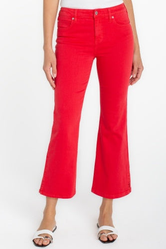 Red flared jeans worn by a person on a white background