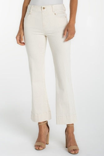White ribbed pants worn by a person on a white background