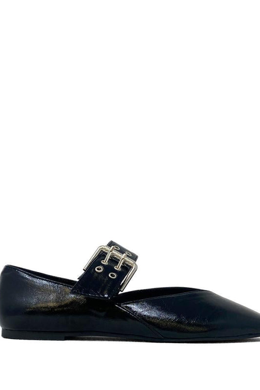 Black flat shoe with a decorative buckle on a white background